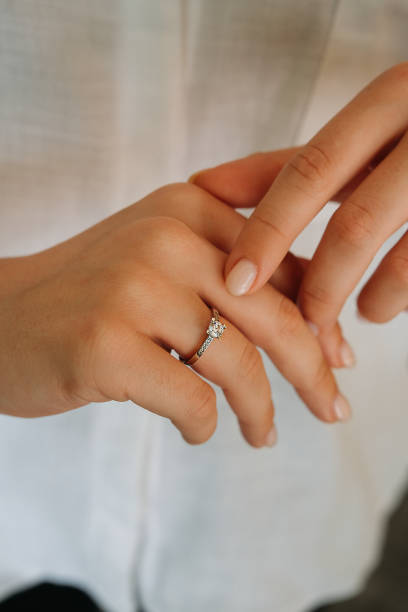 istock Young woman's hand wearing a diamond ring. wedding accessories bride. 1742117999