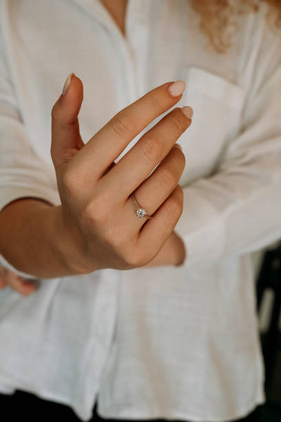 istock Young woman's hand wearing a diamond ring. wedding accessories bride. 1742118000