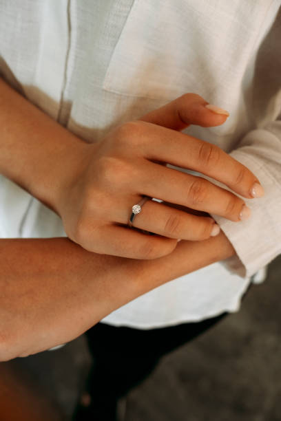 istock Young woman's hand wearing a diamond ring. wedding accessories bride. 1742118015