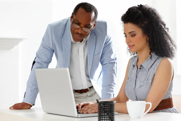 istock Young female working with her mentor standing by 174212251