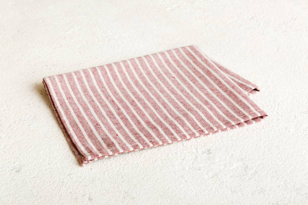 istock top view with red empty kitchen napkin isolated on table background. Folded cloth for mockup with copy space, Flat lay. Minimal style 1742123254
