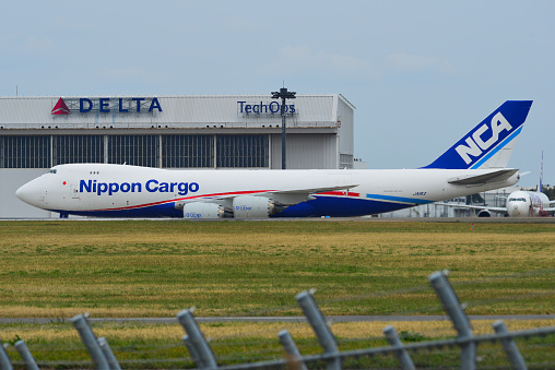 Tokyo, Japan - Apr 17, 2019. JA11KZ Nippon Cargo Airlines Boeing 747-8F docking at Tokyo Narita Airport (NRT). Narita is the second-busiest passenger airport in Japan.