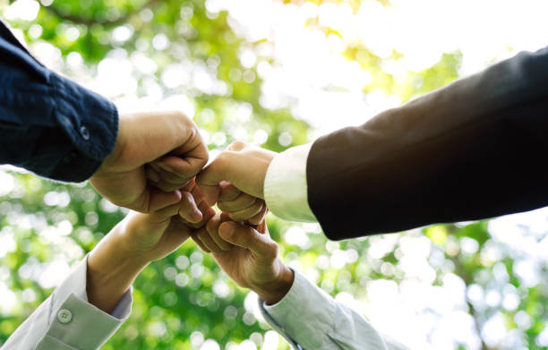 istock Group of volunteer people joining for cooperation about global community teamwork with join hand together, World environment day, sustainable development goal. 1742126721