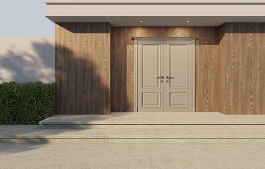 Entrance door to the main house Dark wood paneled house walls  style modern with bushes and shadows of large trees.3d render