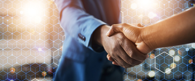 Partnership, business and hand shake in overlay with deal, hexagon grid and b2b connectivity. Digital hologram, negotiation and men shaking hands for networking, opportunity and agreement on mockup.