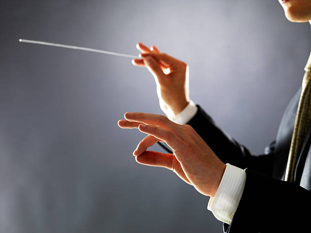 Keeping perfect time  conductors baton photos stock pictures, royalty-free photos & images