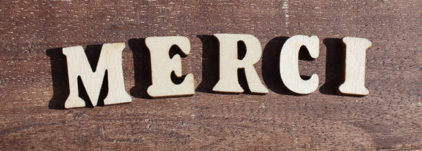 istock create word MERCI from wooden letter alphabet 1742147750