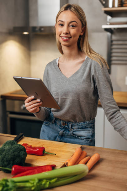 istock female student prepares food at home 1742151893