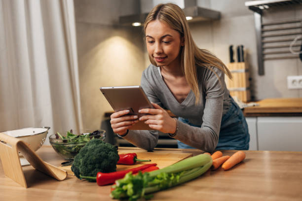 istock female student prepares food at home 1742151896