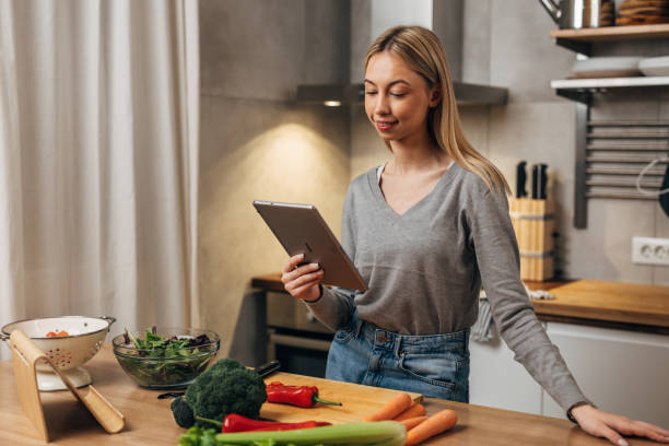 istock female student prepares food at home 1742151904