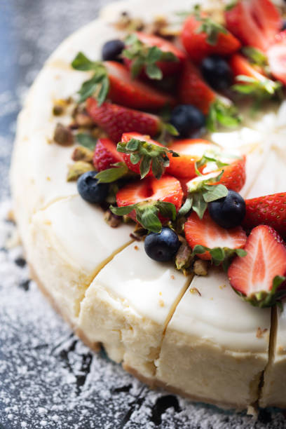 istock Meringue cake background. Top view cake. Fruit decorations. Red strawberries and raspberries on Pavlova whipped cream cake. Sweet dessert round cake. Decorated with berries. 1742152557