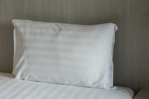 White pillows on a bed comfortable soft pillows on the bed. Close up