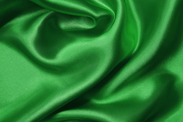 istock Green fabric texture background, detail of silk or linen pattern. 1742170598