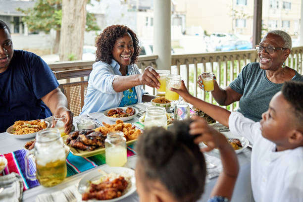 Celebratory toast with lemonade before outdoor meal