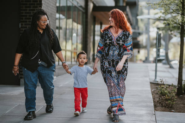 istock Happy little boy having fun exploring the city with his moms 1742203737