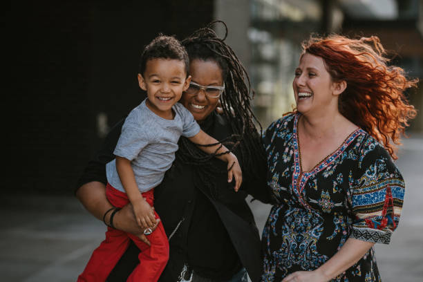 istock Happy family walking down city sidewalk 1742203739