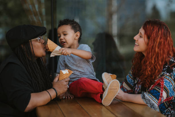 istock Sweet toddler boy sharing ice cream with his mom 1742203764