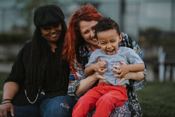 istock Little boy laughing while spending time with his family outside 1742203765