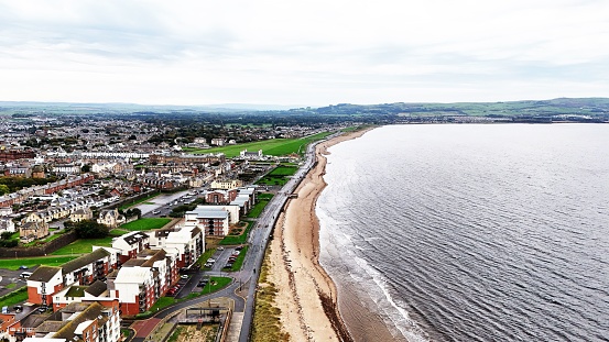 An aerial view of beautiful homes situated on the stunning coastline of Ayr, Scotland