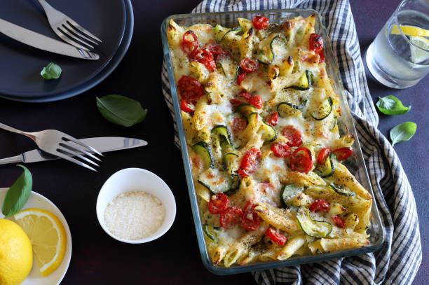 istock Baked pasta with zucchini, cherry tomatoes and parmesan cheese. 1742216297