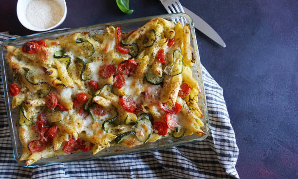 istock Baked pasta with zucchini, cherry tomatoes and parmesan cheese. 1742216805