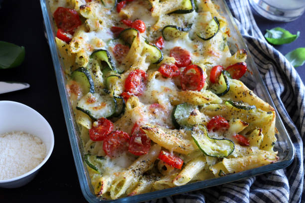 istock Baked pasta with zucchini, cherry tomatoes and parmesan cheese. 1742216829