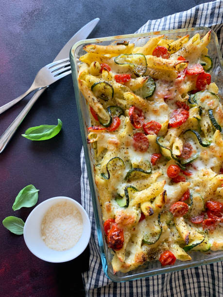 istock Baked pasta with zucchini, cherry tomatoes and parmesan cheese. 1742216845