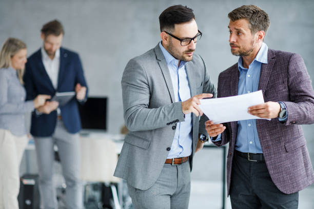 istock Young businessmen working on reports in the office. 1742221235
