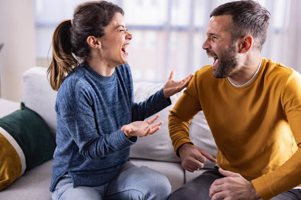 istock Cheerful couple having fun while laughing at home. 1742222334