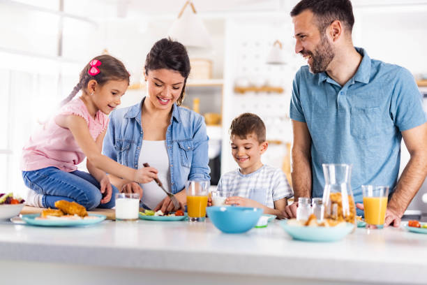 istock Happy family enjoying during breakfast in dining room. 1742224474