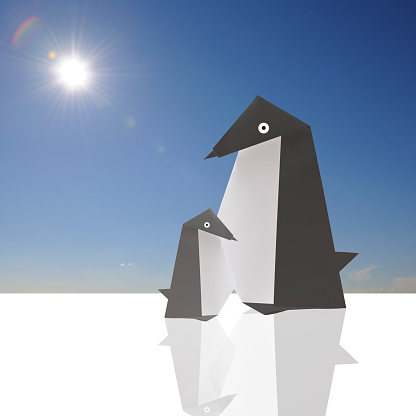A family of origami penguins sitting on the melting ice of climate change against clear sky with sun. 
Climate Change.