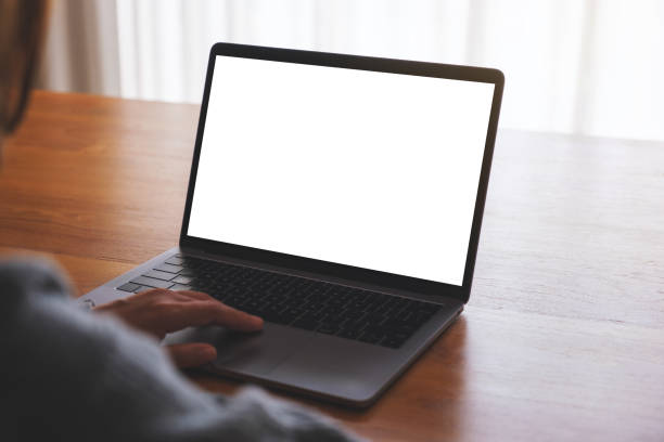 istock Mockup image of a woman using and working on laptop computer with blank white desktop screen 1742232258