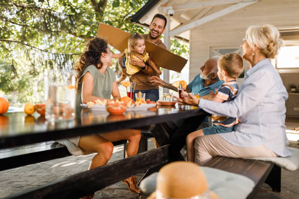 istock Happy extended family having fun on a patio. 1742237624