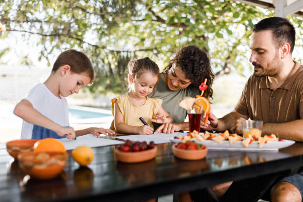 istock Happy family enjoying while coloring in the backyard. 1742239326