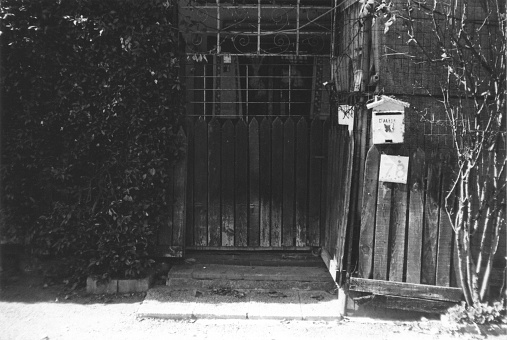 Entrance of an old Wooden Shack in Milano City Suburbs, Italy. Black and White Film Photography