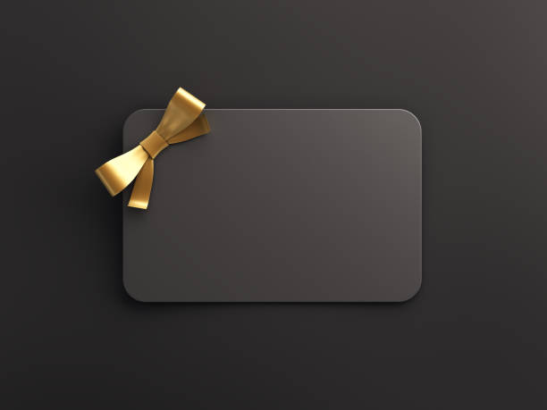 Empty Black Gift Card With Gold Bow stock photo