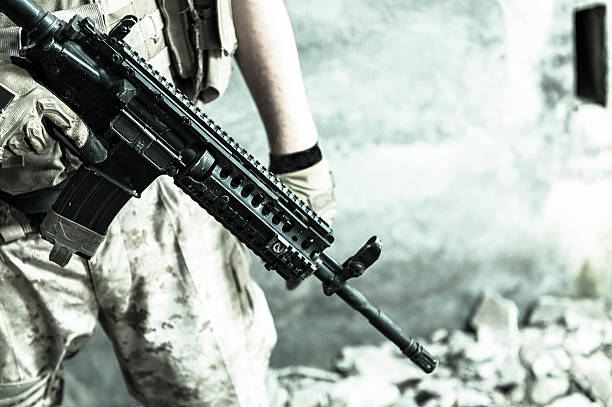 Modern Mercenary Soldier Carrying Automatic Assault Rifle stock photo