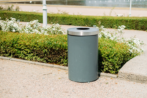 A plastic dustbin is put.