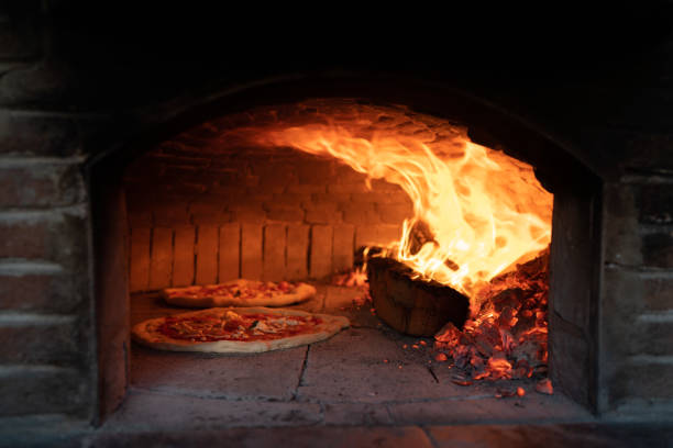 istock Cooking Pizza in a wood oven with high heat 1742276537