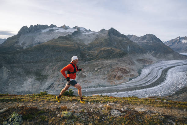 istock Senior male trail runner bounds along mountain trail 1742288609