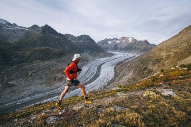 istock Senior male trail runner bounds along mountain trail 1742288659