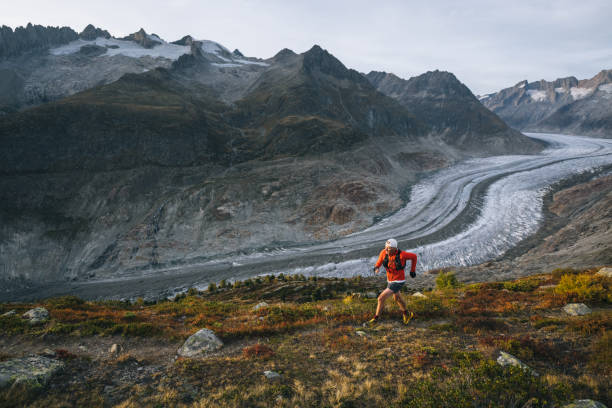 istock Senior male trail runner bounds along mountain trail 1742290823