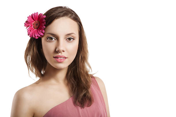 Portrait of girl with flower in hair stock photo