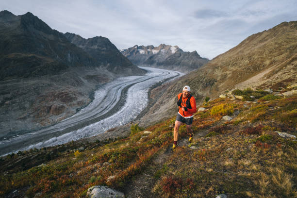 istock Senior male trail runner bounds along mountain trail 1742294106