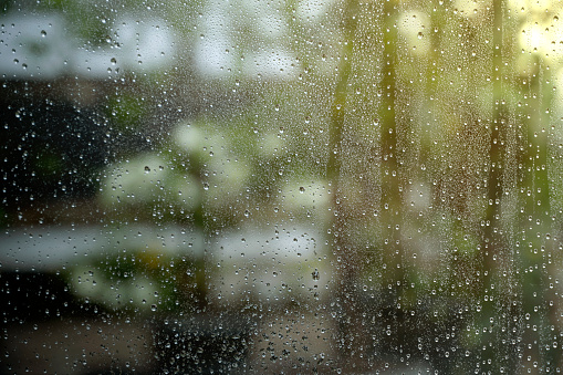 Closeup view of clear window with raindrop background