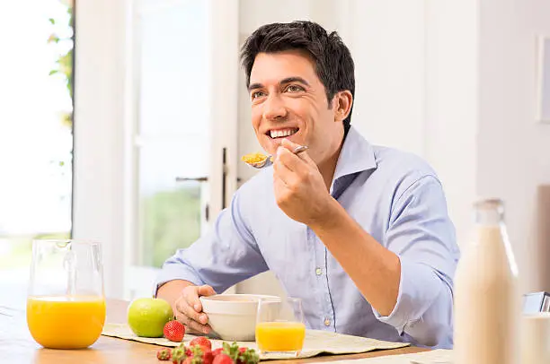 Photo of Man Having Breakfast