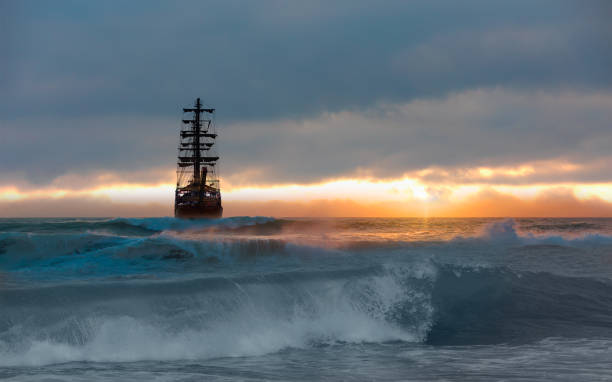 istock Sailing old ship in storm sea on the background heavy clouds with lightning 1742317116