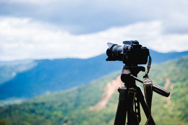 istock Professional camera on tripod capturing beauty of nature. 1742318282