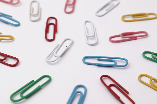 Colorful paper clip office business supplies isolated on white background