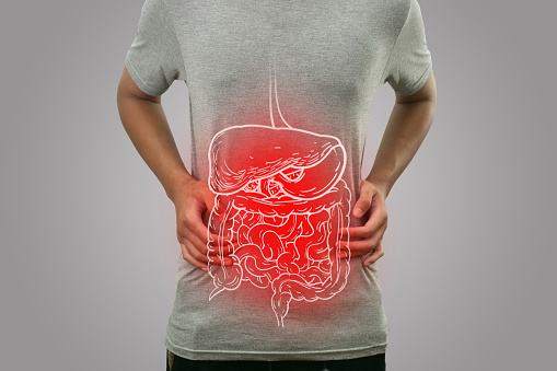 Digital composition of internal digestive system with highlighted red inflammation on sick person, man with stomach pain, health and medical concept